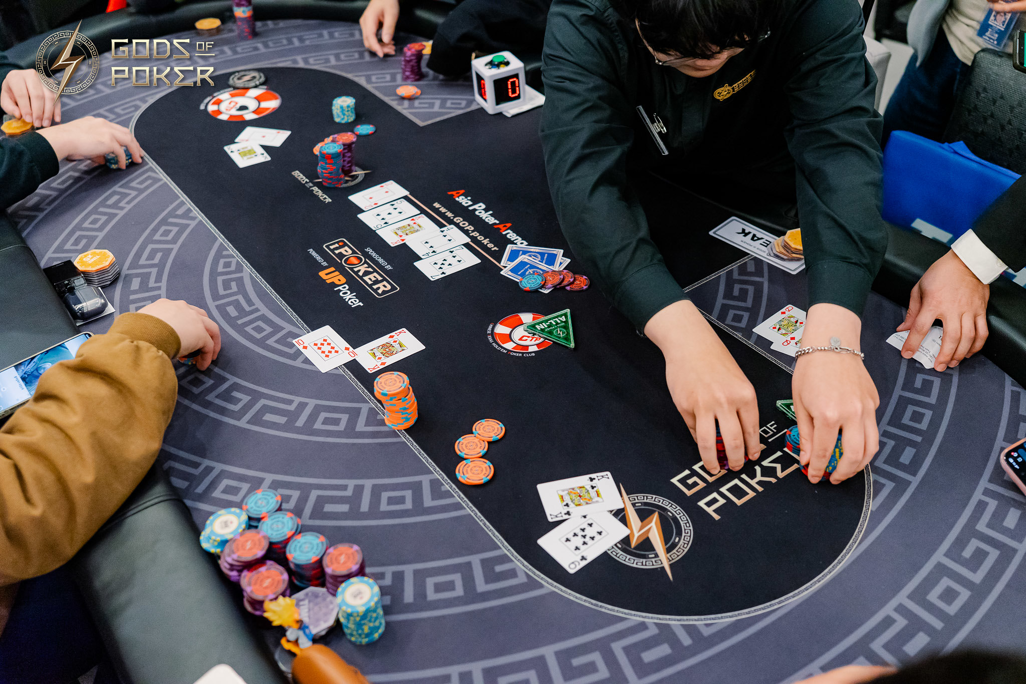 Players engaged in a poker game around a table with chips and cards, Global Poker branding.