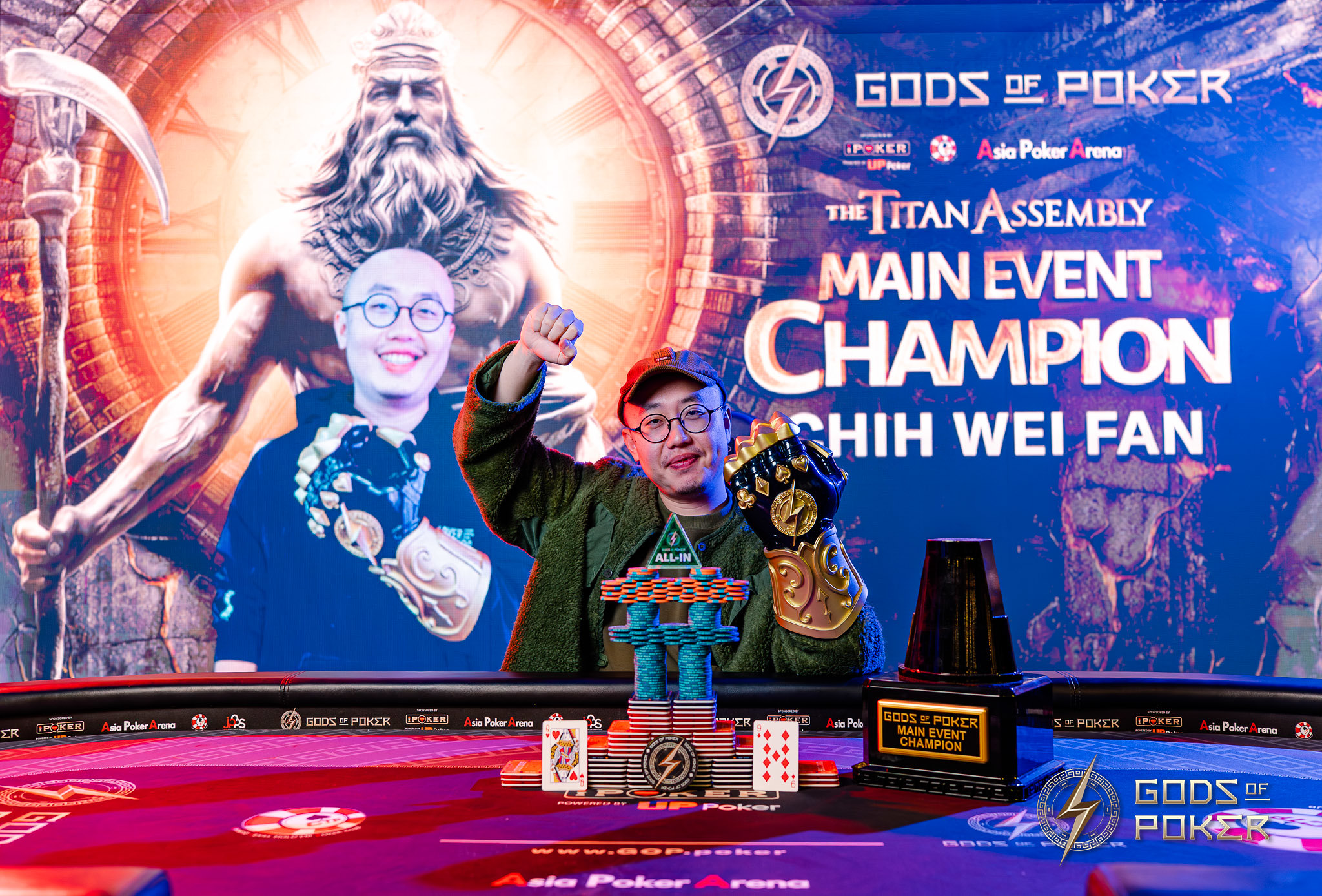 Chih Wei Fan and another champion celebrating their Gods of Poker Main Event victory with trophies.