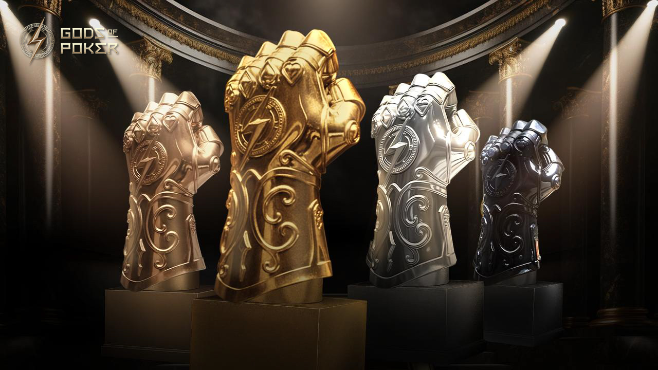 Four bronze, gold, silver, and dark metallic fist trophies displayed for Gods Poker.