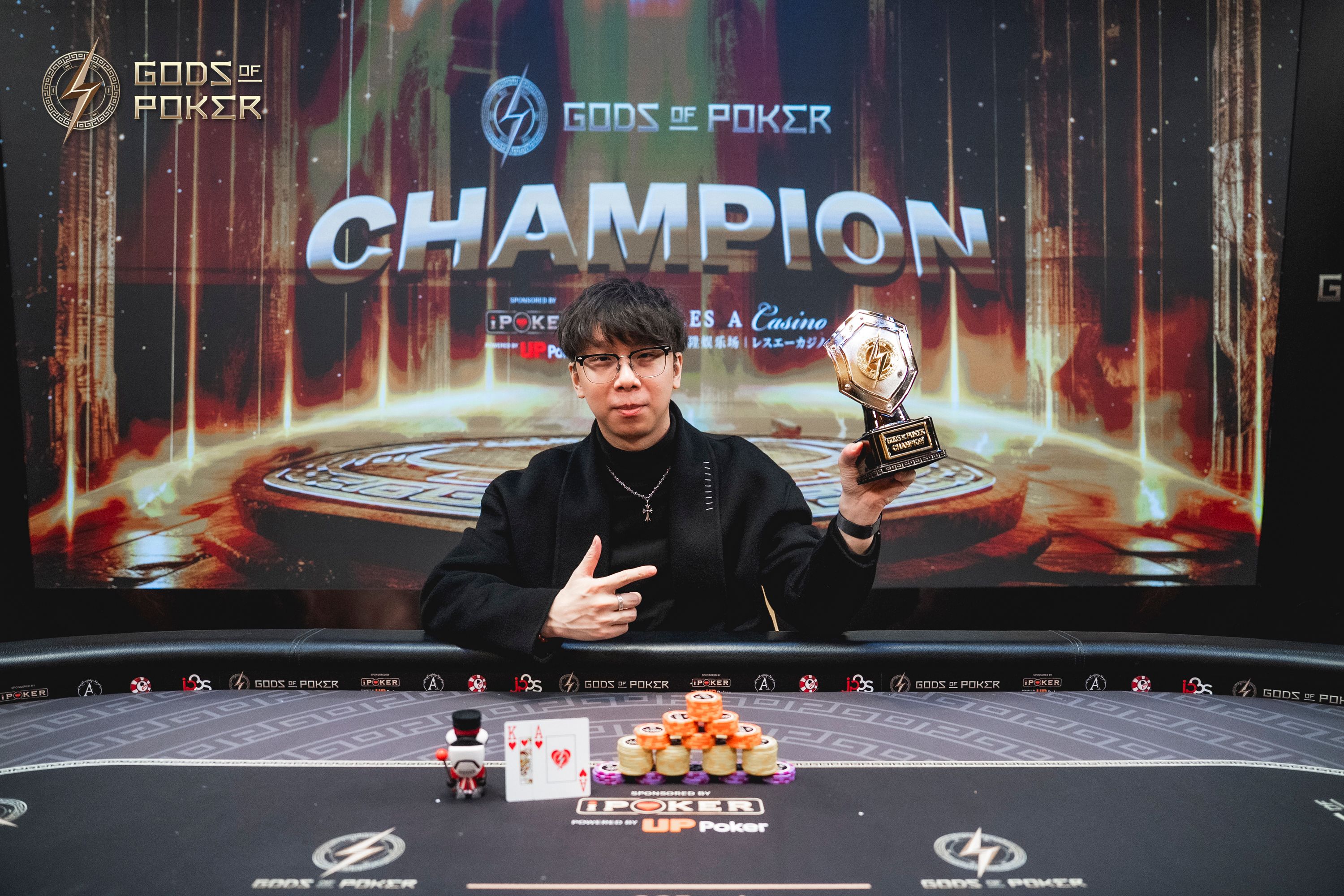 Poker champion proudly displays his trophy and points after a tournament win.